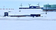 The large blue building is the Kongiganak school, portions of wind and tank farms also visible Kong school.jpg