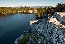 Pecknold had a breakthrough in writing lyrics while traveling back and forth to Upstate New York, including to Lake Minnewaska (pictured). Lake Minnewaska from cliffs.jpg