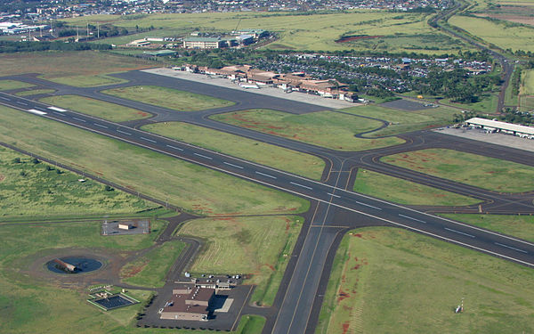 Runway 03/21 and the passenger terminal in background; fire station in foreground.