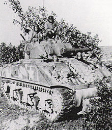 Lt. Col. Creighton Abrams, commander of the 37th Tank bn, on his command tank M4 Abrams.jpg