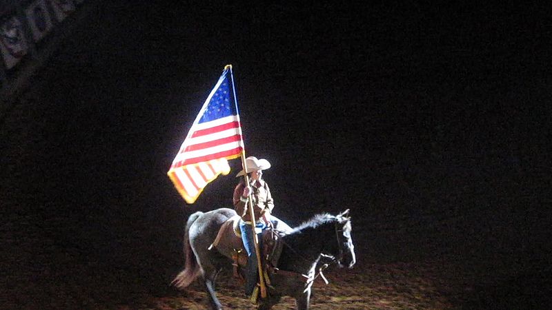 File:MVI 2995 Rider with flag begins rodeo.jpg