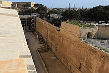 Ditch of Valletta, which was built between 1566 and the 1570s. Malta - Valletta - St. John's Counterguard + Valletta Ditch (St. John's Bastion) 01 ies.jpg