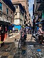 Man riding bicycle during the lockdown on the streets of Ason, Nepal