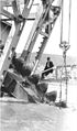 Man sitting on structure of mining dredge apparatus, ca 1912 (THWAITES 330).jpeg