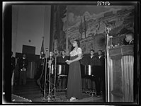 Marian Anderson at the ceremony held in the auditorium of the U.S. Department of the Interior at the dedication of a mural painting commemorating a free public concert given by her on the steps of the Lincoln Memorial on Easter Sunday, 1939