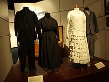 A clothing exhibit at the Mennonite Heritage Village museum showing apparel worn by Mennonite men and women. Mennonite Heritage Village Steinbach Manitoba Canada 1 (8).JPG