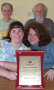 MPT members smile behind a 2007 certificate from the Palestinian National Authority Michigan Peace Team members smile behind 2007 certificate of award from the Palestinian National Authority.jpg