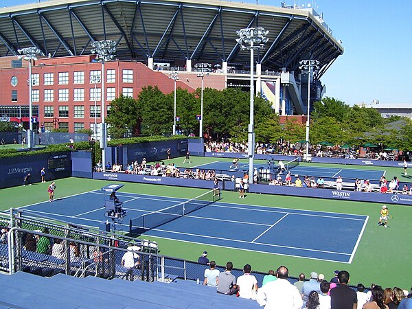 Some of the side courts, with Ashe Stadium in the background, before the canopy was added