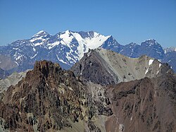 Nevado del Plomo (left) and Nevado Juncal (behind) are two mountains of the Principal Cordillera along the Argentina-Chile border and the Atlantic-Pacific watershed.
