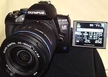 An articulating screen in the Olympus E-620. Olympus E-620 front.jpg