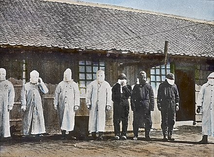 Plague workers in personal protective equipment