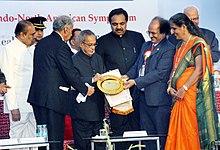 Yadav with President Pranab Mukherjee in 2013. Pranab Mukherjee being presented a memento at the inauguration of the 66th annual session of Indian Institute of Chemical Engineers (IIChE), CHEMCON 2013, at Institute of Chemical Technology.jpg