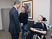 The U.S. President Barack Obama visits the Georgian officer Alex Tugushi, wounded in Afghanistan, on March 2, 2012. President Barack Obama visits LTC Alex Tugushi (March 2 2012).jpg