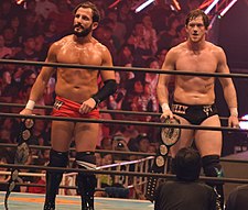 (Left to right) Bobby Fish และKyle O'Reilly, reDRagon, กับเข็มขัดแชมป์ในเดือนพฤศจิกายน ค.ศ. 2015