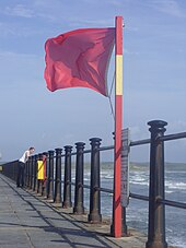 Red flag at a beach in Ireland, indicating that the water is not safe for swimming Red flag at beach.jpg