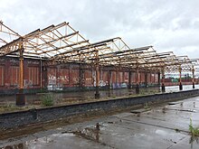 Remains of the station canopy in 2020, having been mostly removed in March 2013 due for safety following the fire Remains of station canopy at Mayfield.jpg