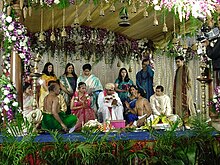 Bride and groom as a royal couple under the mandap, day-time photography with fill-in flash South India wedding.JPG