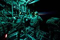 National Guardsmen with Company A, 2nd Battalion, 20th Special Forces Group (Airborne) prepare to exit a C-130 Hercules during a night training mission over Muscatatuck, Ind., Monday, Aug. 3, 2015.