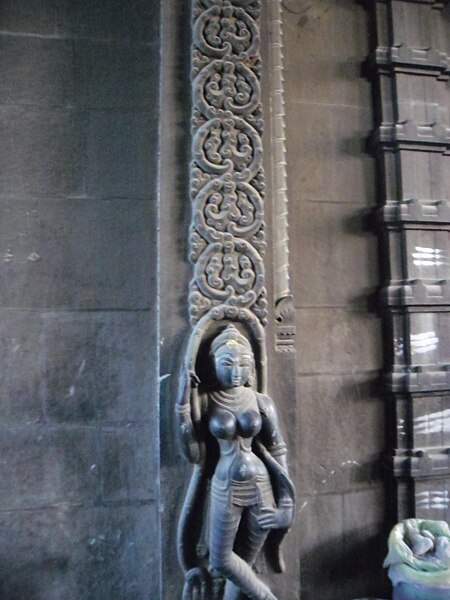 File:Statue in temple wall.JPG