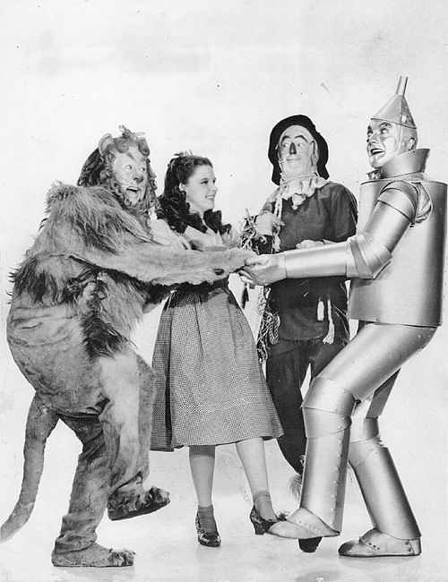 Adrian's costume designs for The Wizard of Oz (1939), L–R: Bert Lahr, Judy Garland, Ray Bolger, and Jack Haley