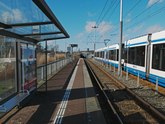 Tram 26 is riding along tram stop Kattenburgerstraat; free photo Amsterdam, Fons Heijnsbroek February 2022