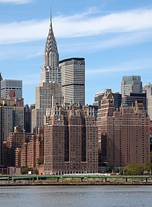 Windsor Tower (center), Tudor Tower (right), Woodstock Tower (between them), and 2 Tudor City Place (bottom left), with the Chrysler Building and the MetLife Building in the background Tudor City and the Chrysler Building from the East River.jpg