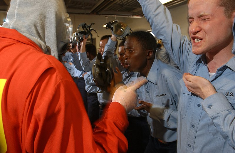 File:US Navy 030509-N-5862D-164 Navy instructor, Damage Controlman 2nd Class, Shawn Love exposes a division of recruits to tear gas as they remove their Gas Mask (MCU-2-P).jpg