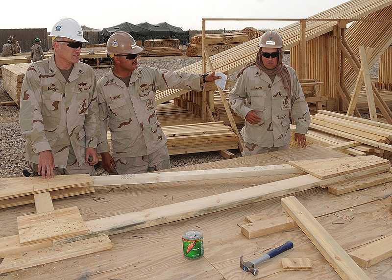 File:US Navy 090506-N-9410R-094 Builder 1st Class Rodney Rodriguez, assigned to Naval Mobile Construction Battalion (NMCB) 5, explains the work in progress and the preparation work for future projects to Capt. Jeff Borowy.jpg