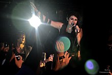 Kusterbeck performing with VersaEmerge at the Vultures United Tour, October 2010 VersaEmerge Vultures Unite Tour.jpg