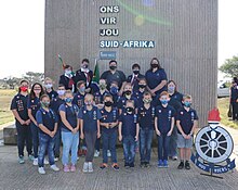 Voortrekker children attending a memorial service at Karel Landman Monument near Alexandria, Eastern Cape. Children are wearing the new (current) standard attire. Voortrekkers by Karel Landman Monument.jpg