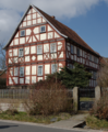 English: Half-timbered building (rectory) in Wartenberg, Landenhausen, Kirchweg 2, Hesse, Germany.