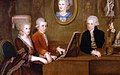 Mozart mit Schwester Maria Anna und Vater Leopold, an der Wand ein Portrait der verstorbenen Mutter, Anna Maria. Gemälde von Johann Nepomuk della Croce um 1780