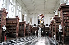 The interior of the library, showing the limewood carvings by Grinling Gibbons WrenLibraryInterior.jpg