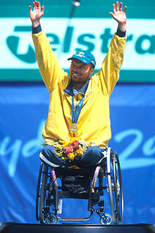 Hall on the podium celebrating his gold medal win at the 2000 Summer Paralympics 141100 - Wheelchair tennis David Hall podium medal - 3b - 2000 Sydney ceremony photo.jpg