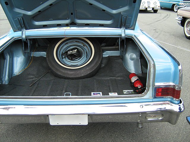 A trunk in the rear will often contain a spare wheel.