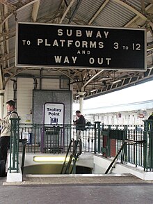 This sign should read "Platforms 1 to 12" but refers to the earlier numbering system when these platforms were numbers 1 and 2. They are now 15 (left) and 13 (right). 2008 at Bristol Temple Meads - Platform 13 subway sign.jpg