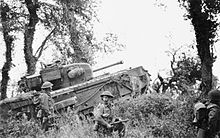 A Churchill tank of 7th Royal Tank Regiment, 31st Tank Brigade, supporting infantry of 8th Royal Scots during Operation Epsom, 28 June 1944. 7th Royal Tank Regiment supporting 8th Royal Scots 28-06-1944.jpg