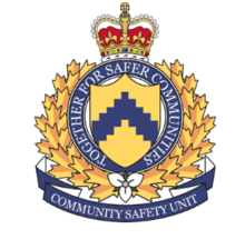The new heraldic crest of TCHC's Community Safety Unit, developed on January 24, 2022. A blue and gold crest with a the Royal Crown over the words "Together for safer communities" and a white trillium flower.png