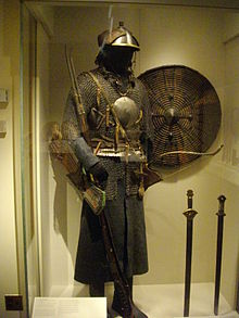 Tibetan Cavalry armor; riveted mail hauberk with mirror armor, steel helmet, armored belt, 18th-19th century, Met museum. Antique chainmail armour with mirror.jpg