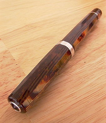 Celluloid and sterling silver pen.