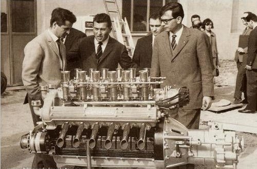 From left to right: Giotto Bizzarrini, Ferruccio Lamborghini and Giampaolo Dallara at Sant'Agata Bolognese in 1963, with a Lamborghini V12 engine prot