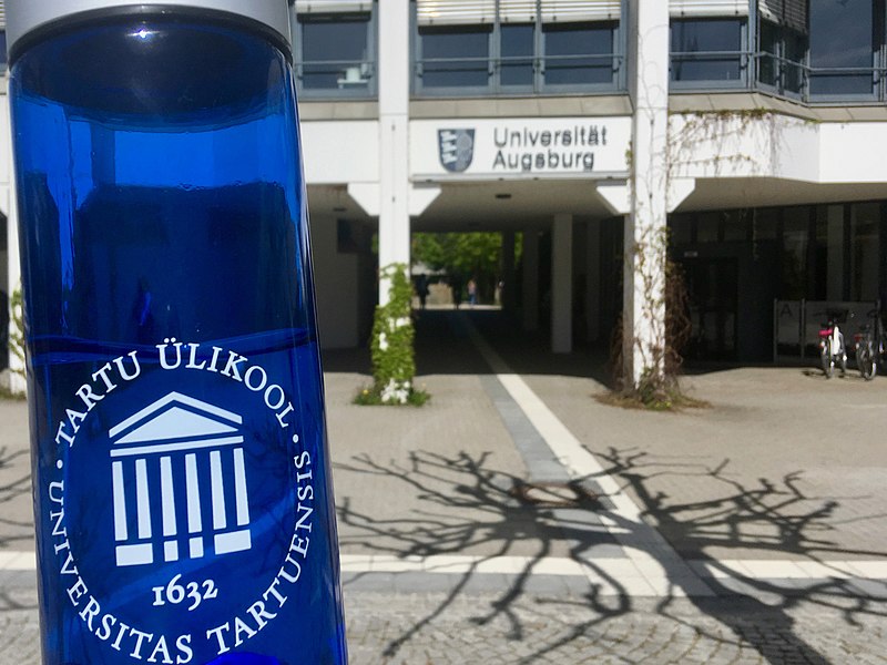 File:Bottle of University of Tartu and building of University of Augsburg 2019.jpg