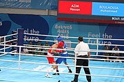 Deutsch: Boxen bei den Olympischen Jugendspielen 2018 Tag 12, 18. Oktober 2018 - Kampf um Bronze im Leichten Weltergewicht Jungen – Hassan Azim (Großbritannien, rot) schlägt Mohammed Boulaouja (Marokko, blau) RSC; Ringrichter ist Wulfren Olivares Peréz (Kolumbien). English: Boxing at the 2018 Summer Youth Olympics on 18 October 2018 – Bronze Medail Match Light Welterweight Boys - Hassan Azim (Great Britain, red) beats Mohammed Boulaouja (Morocco, blue) RSC; Referee is Wulfren Olivares Peréz (Columbia). Español: Boxeo en los Juegos Olímpicos Juveniles de Verano de 2018 en 18 de octubre de 2018 - Medalla de bronce de los hombres ligeros de peso welter: Hassan Azim (Gran Bretaña, rojo) vence a Mohammed Boulaouja (Marruecos, azul) RSC; El árbitro es Wulfren Olivares Peréz (Colombia).