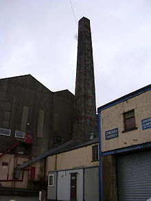 Broadclough Mill's chimney still dominates the area