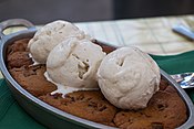 A cookie dessert, topped with ice cream.