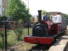 Locomotive "Cloister" (on loan) passes the museum garden Cloister, Museum locomotive.jpg
