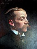 Perfil de Édouard Kann, careca, olhando para a direita, bigode.