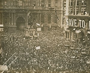 Armistice Day celebrations in Philadelphia, Pennsylvania on 11 November 1918 First News of Peace! Confetti thrown by happy crowds. Liberty sings. Flags waved. Nov. 11-1918. (12795375585) (cropped).jpg