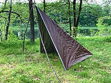 An improvised Forester tent using an 8-foot square tarp, folded into two triangles along its diagonal Forester Tent Tarp and Poles (6262CE06).jpg