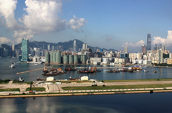 Hung Hom skyline in 2009, viewed from the east (Kwun Tong). The strip of land in the foreground is the former runway of the retired Kai Tak Airport.